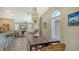 Charming dining area with a rustic wooden table and stylish chandelier at 2402 Palmetto St, Nokomis, FL 34275