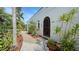 Landscaped walkway leading to the front entrance of the home at 2402 Palmetto St, Nokomis, FL 34275