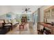 Bright living room with hardwood floors, comfy seating, and access to a patio at 2402 Palmetto St, Nokomis, FL 34275