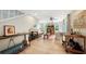 Bright living area with tiled floor, comfy seating, and a bar cart at 2402 Palmetto St, Nokomis, FL 34275