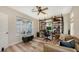Home office with built-in shelving, large windows, and comfortable seating at 2402 Palmetto St, Nokomis, FL 34275