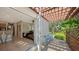 View of a kitchen and living room from a relaxing patio at 2402 Palmetto St, Nokomis, FL 34275
