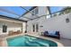 Enclosed pool with a spacious patio and seating at 2402 Palmetto St, Nokomis, FL 34275