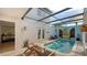 Relaxing, private courtyard pool with covered patio and seating at 2402 Palmetto St, Nokomis, FL 34275