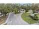 Aerial view of Village Brook community entrance with lush landscaping and parking at 3213 Beneva Rd # 201, Sarasota, FL 34232