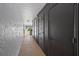 Hallway with storage and access to exterior at 3213 Beneva Rd # 201, Sarasota, FL 34232