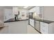 Updated kitchen with stainless steel appliances and granite countertops at 3213 Beneva Rd # 201, Sarasota, FL 34232