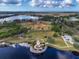 Aerial view of community featuring a lighthouse, lake, and baseball field at 360 Cape Harbour Loop # 105, Bradenton, FL 34212