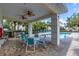 Relaxing poolside patio with tables and chairs at 360 Cape Harbour Loop # 105, Bradenton, FL 34212