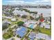Aerial view showing home's location near waterway and pool at 5891 Tidewood Ave # 1, Sarasota, FL 34231