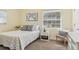 Cozy bedroom with a comfortable bed and plenty of natural light at 5891 Tidewood Ave # 1, Sarasota, FL 34231