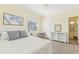 Spacious bedroom with a queen-size bed and built-in shelving at 5891 Tidewood Ave # 1, Sarasota, FL 34231