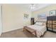 Charming bedroom with a comfortable bed and a ceiling fan at 5891 Tidewood Ave # 1, Sarasota, FL 34231