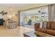 Bright dining area with table and chairs near sliding glass doors at 5891 Tidewood Ave # 1, Sarasota, FL 34231