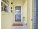 Inviting entryway with a welcome mat and a small plant at 5891 Tidewood Ave # 1, Sarasota, FL 34231