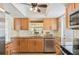Modern kitchen featuring stainless steel appliances and granite counters at 5891 Tidewood Ave # 1, Sarasota, FL 34231