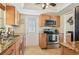 Well-equipped kitchen with granite countertops and wood cabinets at 5891 Tidewood Ave # 1, Sarasota, FL 34231