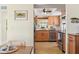 Bright kitchen features stainless steel appliances and light wood cabinets at 5891 Tidewood Ave # 1, Sarasota, FL 34231