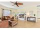 Spacious living room with comfortable leather sofas and a large TV at 5891 Tidewood Ave # 1, Sarasota, FL 34231