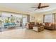 Open living area with sliding doors leading to a screened porch at 5891 Tidewood Ave # 1, Sarasota, FL 34231