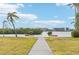 Pathway leading to waterfront with benches and scenic views at 5891 Tidewood Ave # 1, Sarasota, FL 34231