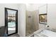 Bathroom with walk-in shower and view of the pool at 6305 Royal Tern Cir, Lakewood Ranch, FL 34202