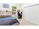 Bedroom with a full-size bed, a workspace, and built-in closet at 6305 Royal Tern Cir, Lakewood Ranch, FL 34202