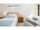 Bright bedroom with a comfortable bed and sitting area at 6305 Royal Tern Cir, Lakewood Ranch, FL 34202