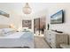 Bright bedroom with a queen-size bed and sliding glass doors leading to the patio at 6305 Royal Tern Cir, Lakewood Ranch, FL 34202
