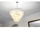 Close-up of an elegant crystal chandelier at 6305 Royal Tern Cir, Lakewood Ranch, FL 34202
