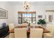 Elegant dining room featuring a wood table and chandelier at 6305 Royal Tern Cir, Lakewood Ranch, FL 34202