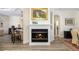 Living room fireplace with a beautiful painting above at 6305 Royal Tern Cir, Lakewood Ranch, FL 34202