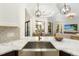 Modern kitchen with farmhouse sink and a view of the backyard at 6305 Royal Tern Cir, Lakewood Ranch, FL 34202