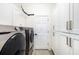 Laundry room with ample storage and modern appliances at 6305 Royal Tern Cir, Lakewood Ranch, FL 34202