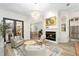 Cozy living room with a fireplace and comfortable seating at 6305 Royal Tern Cir, Lakewood Ranch, FL 34202