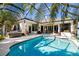 Resort-style pool and spa with lush landscaping at 6305 Royal Tern Cir, Lakewood Ranch, FL 34202