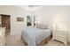 Comfortable bedroom with a queen-size bed and en-suite bathroom access at 7112 Saint Johns Way, University Park, FL 34201