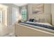 Nautical-themed bedroom with built-in desk and window seat at 7122 Whittlebury Trl, Bradenton, FL 34202