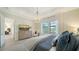 Main bedroom with dresser and view into the kitchen at 7122 Whittlebury Trl, Bradenton, FL 34202