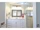 Clean bathroom with white cabinets and walk-in shower at 8224 Country Oaks Ct, Sarasota, FL 34243