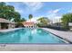 Relaxing community pool with plenty of lounge chairs at 8224 Country Oaks Ct, Sarasota, FL 34243