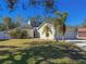 Charming single-Gathering home with a two-car garage and manicured lawn at 8224 Country Oaks Ct, Sarasota, FL 34243