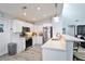 Well-equipped kitchen featuring white cabinetry and granite counters at 8224 Country Oaks Ct, Sarasota, FL 34243