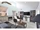 Relaxing living room with comfortable seating and large TV at 8224 Country Oaks Ct, Sarasota, FL 34243
