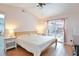 Spacious main bedroom with sliding glass doors to patio at 8224 Country Oaks Ct, Sarasota, FL 34243