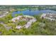 Aerial view showcasing community pool and lakefront location at 119 Tidewater Dr # 119, Bradenton, FL 34210