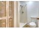 Clean bathroom featuring a shower stall and updated toilet at 119 Tidewater Dr # 119, Bradenton, FL 34210
