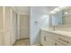Bright bathroom with white vanity, quartz countertop, and updated fixtures at 119 Tidewater Dr # 119, Bradenton, FL 34210