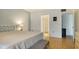 Bright bedroom with wood floors and access to the bathroom at 119 Tidewater Dr # 119, Bradenton, FL 34210