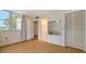 Spacious bedroom with wood floors and large window at 119 Tidewater Dr # 119, Bradenton, FL 34210
